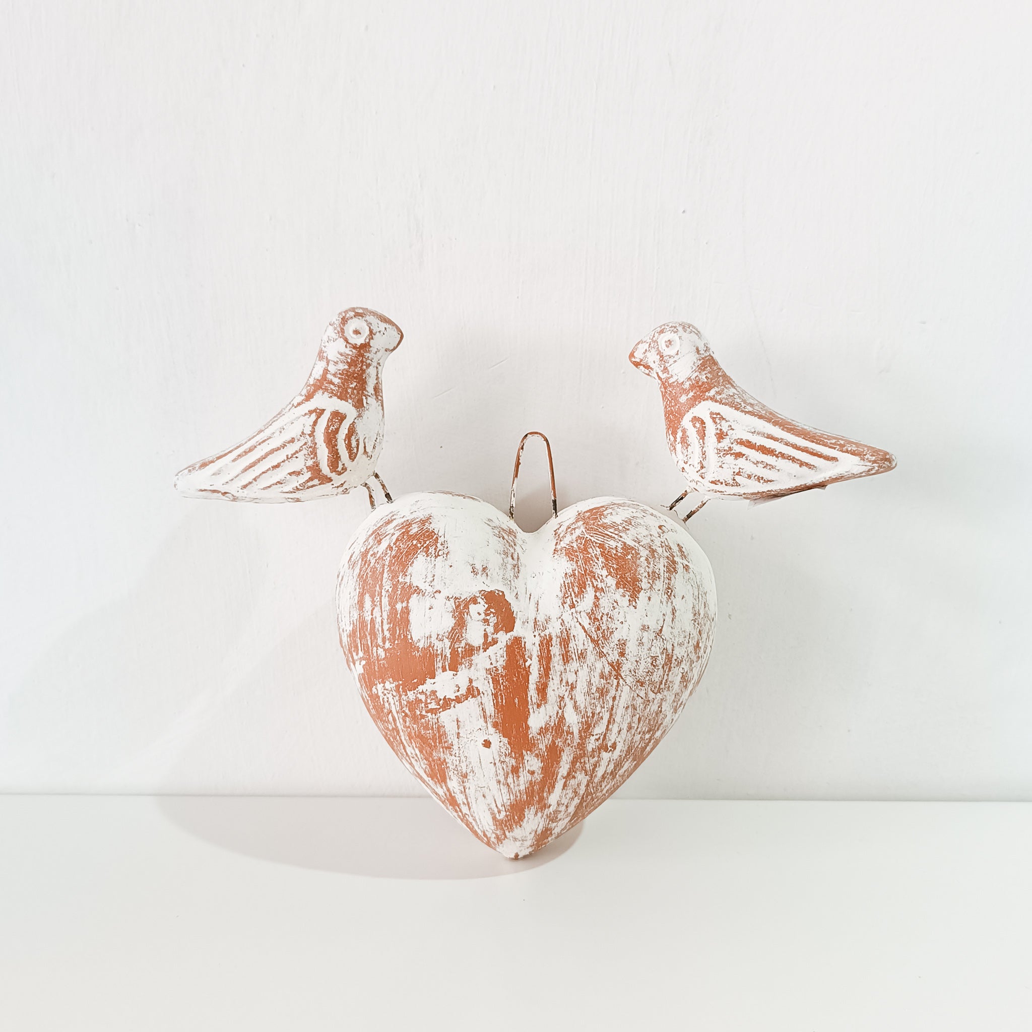 Clay heart with birds