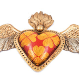 Brass heart with wings and crown of fire