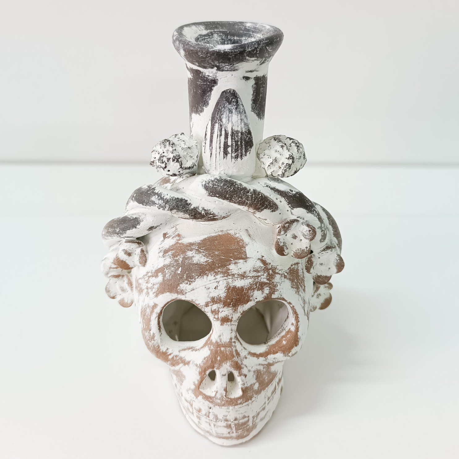 Calaverita skull in clay