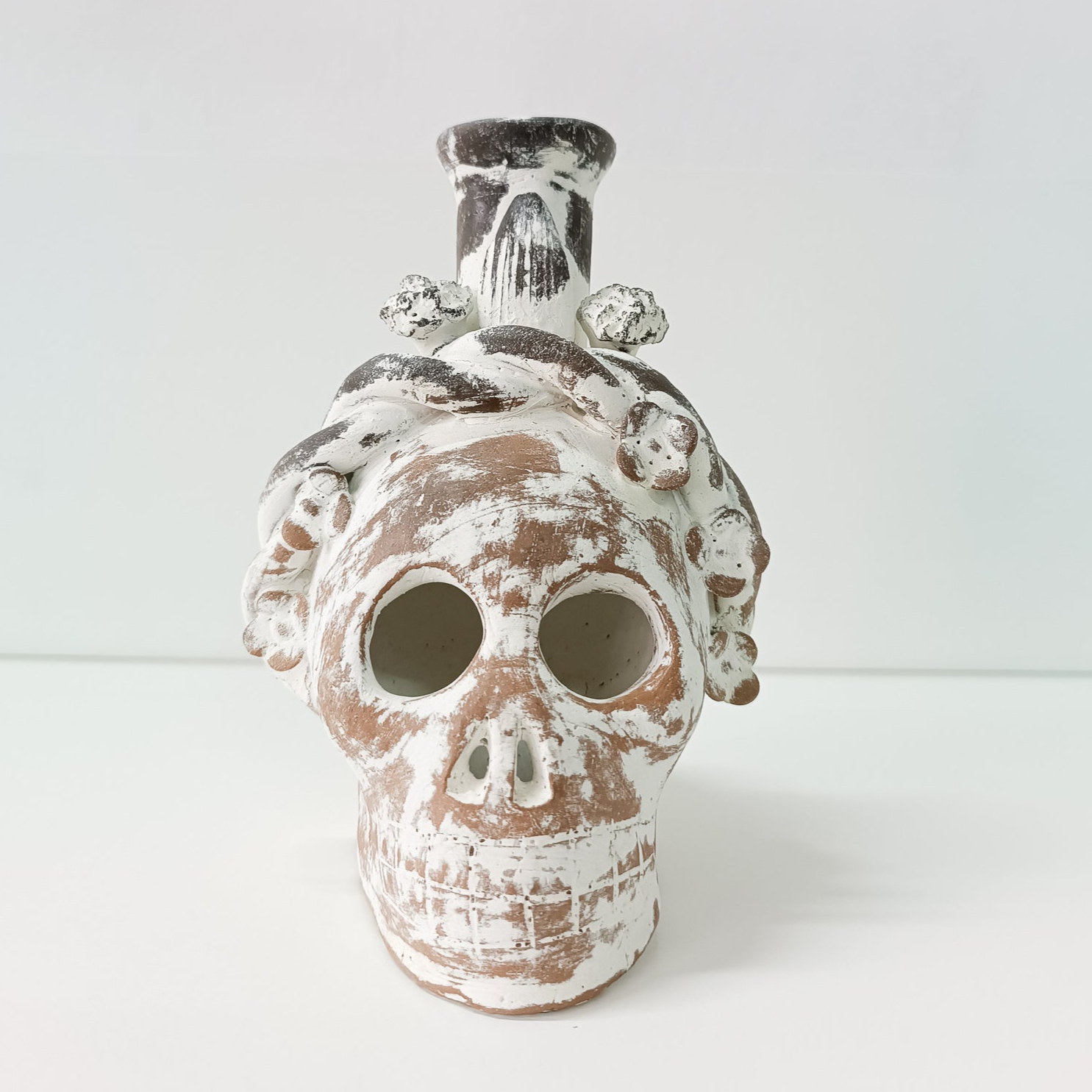 Calaverita skull in clay