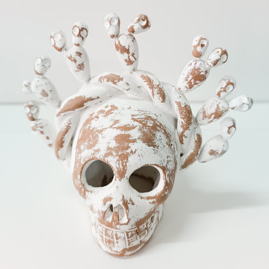 Calaverita skull in clay