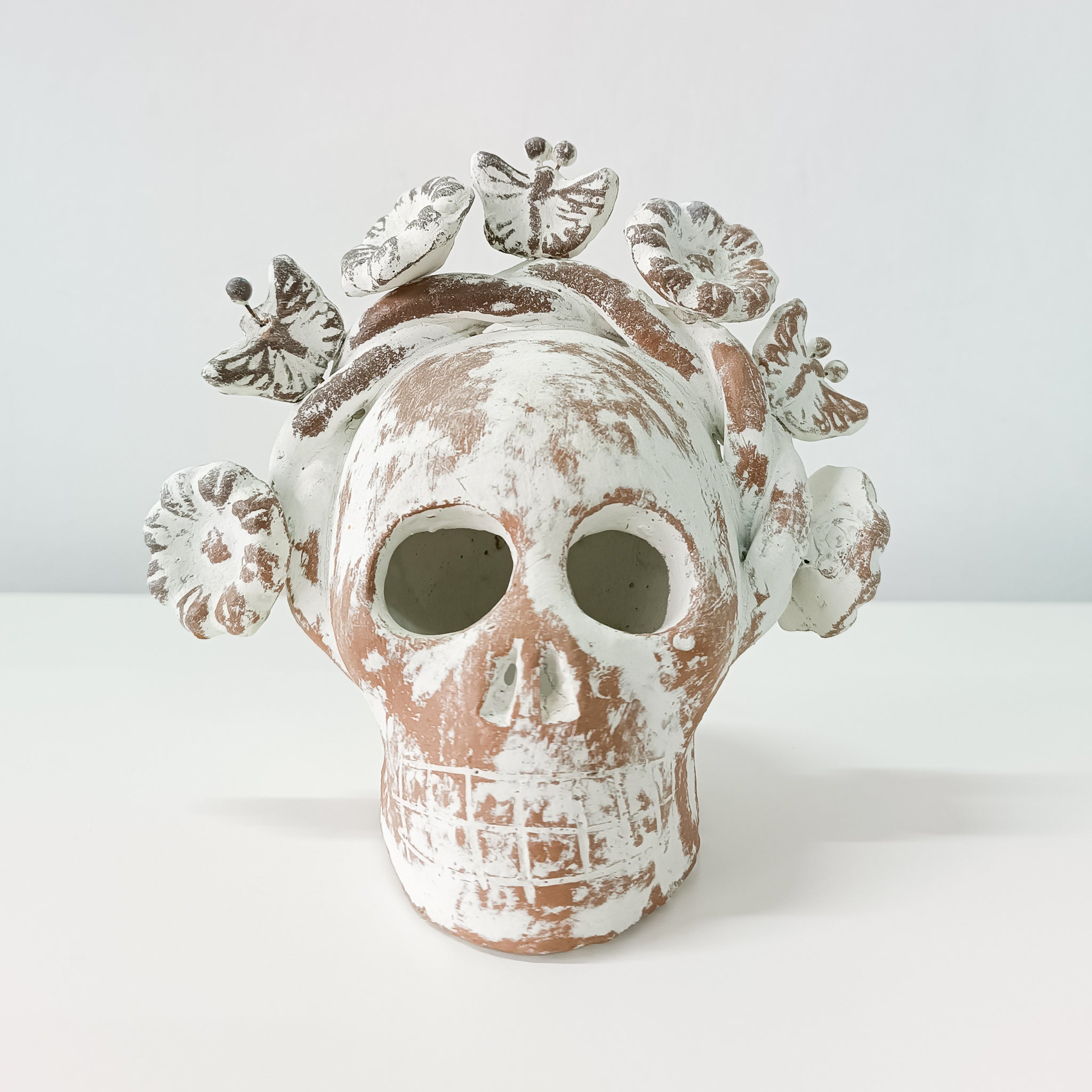 Calaverita skull in clay