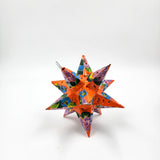 Estrella de hojalata decorada