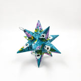 Estrella de hojalata decorada