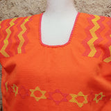 Huipil artesanal de Oaxaca - naranja neón con estrellas amarillas