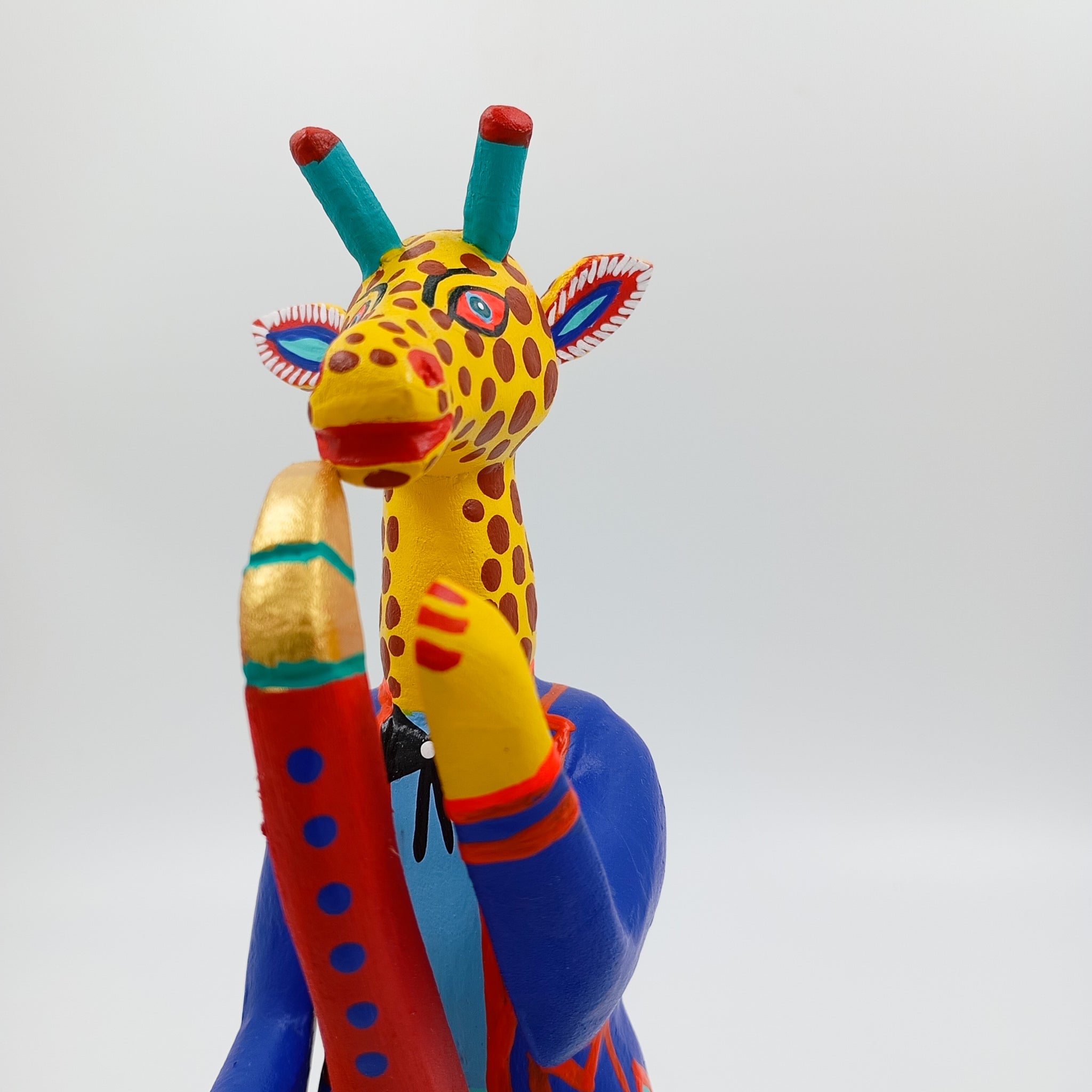 Alebrije jirafa con saxofón - San Martín Tilcajete
