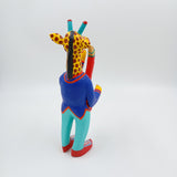 Alebrije jirafa con saxofón - San Martín Tilcajete