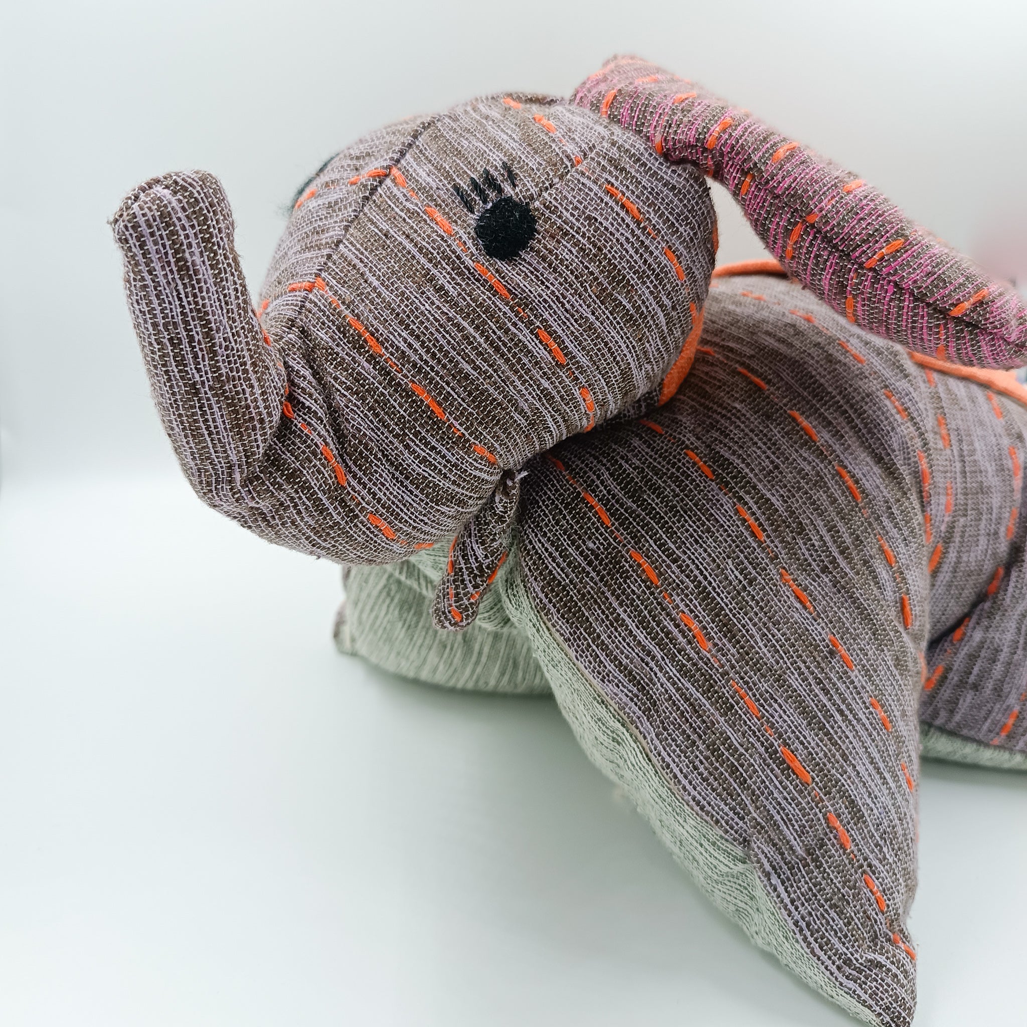 Stuffed animals convertible into cushions - made with backstrap loom