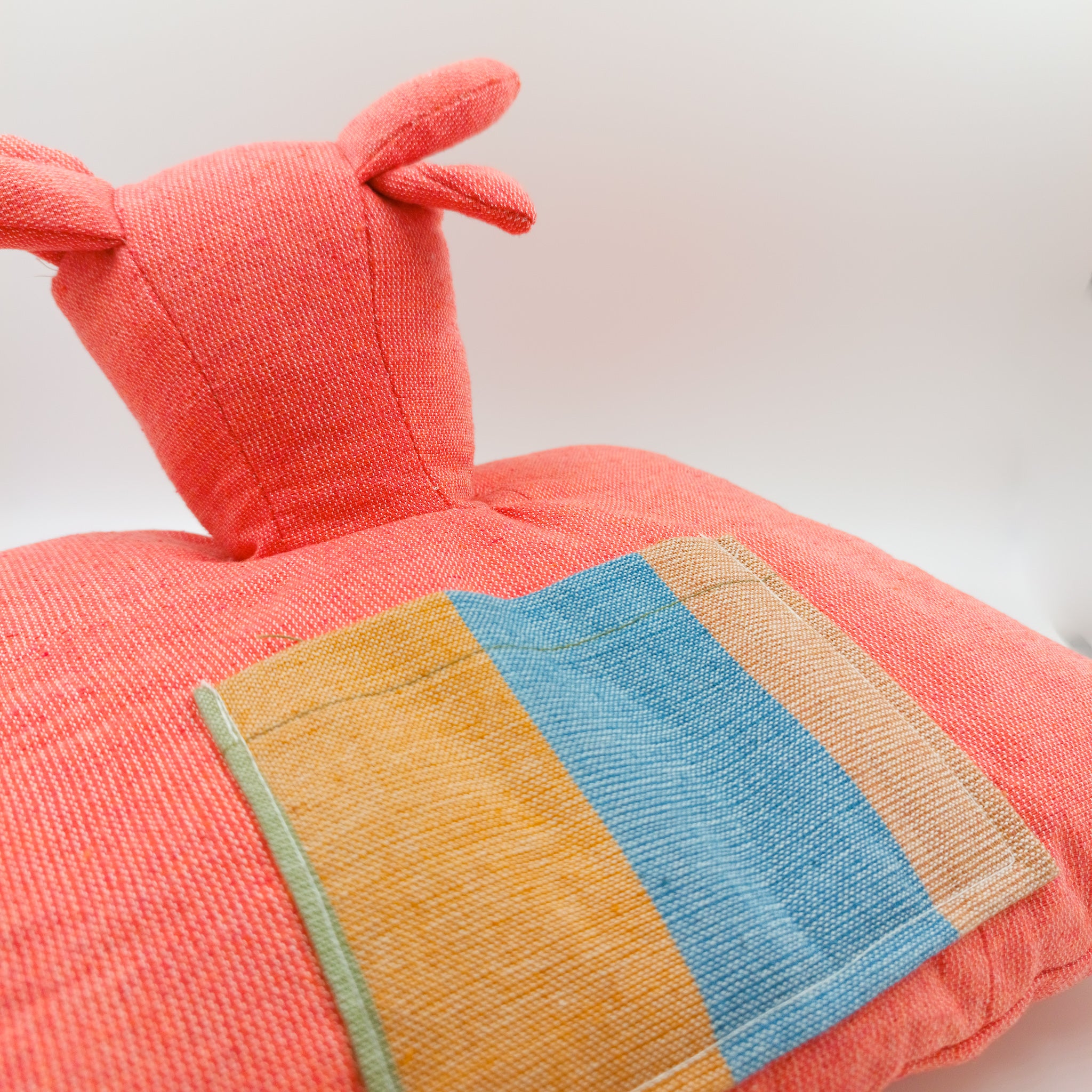 Stuffed animals convertible into cushions - made with backstrap loom