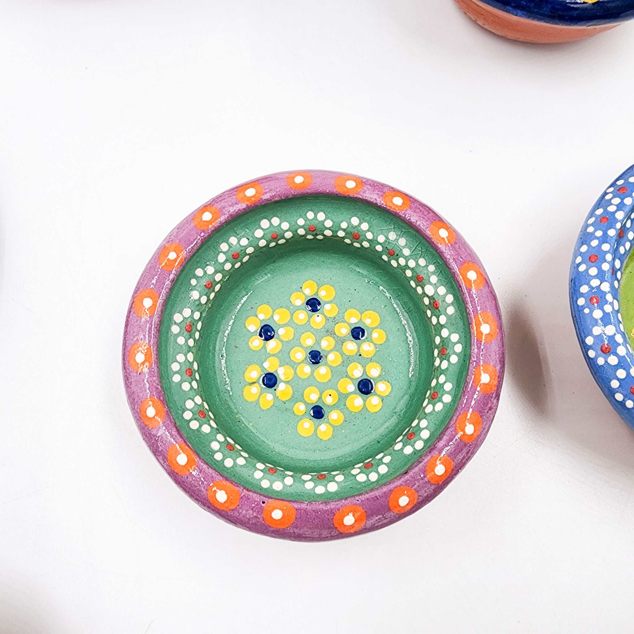 Small hand-painted clay plate