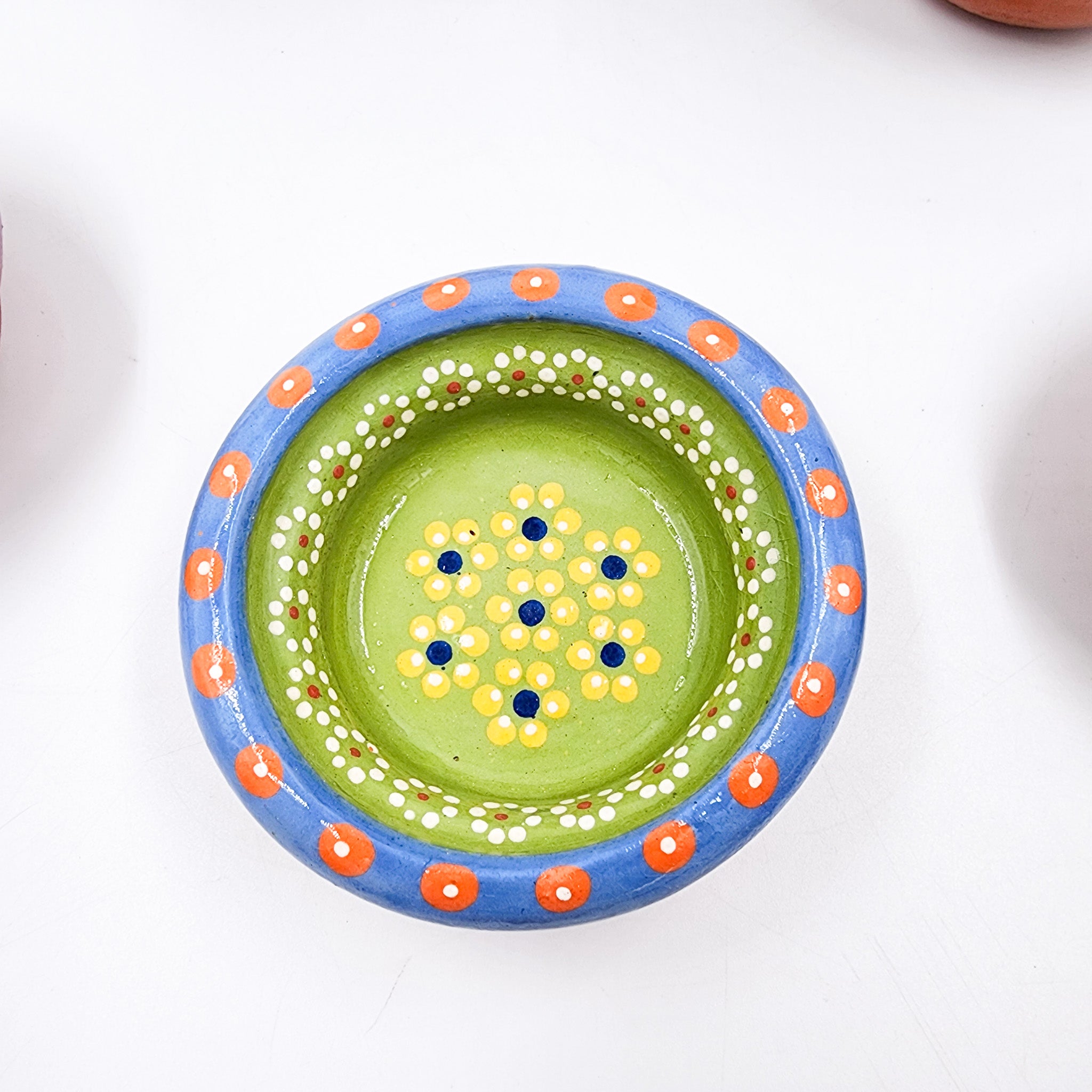 Small hand-painted clay plate