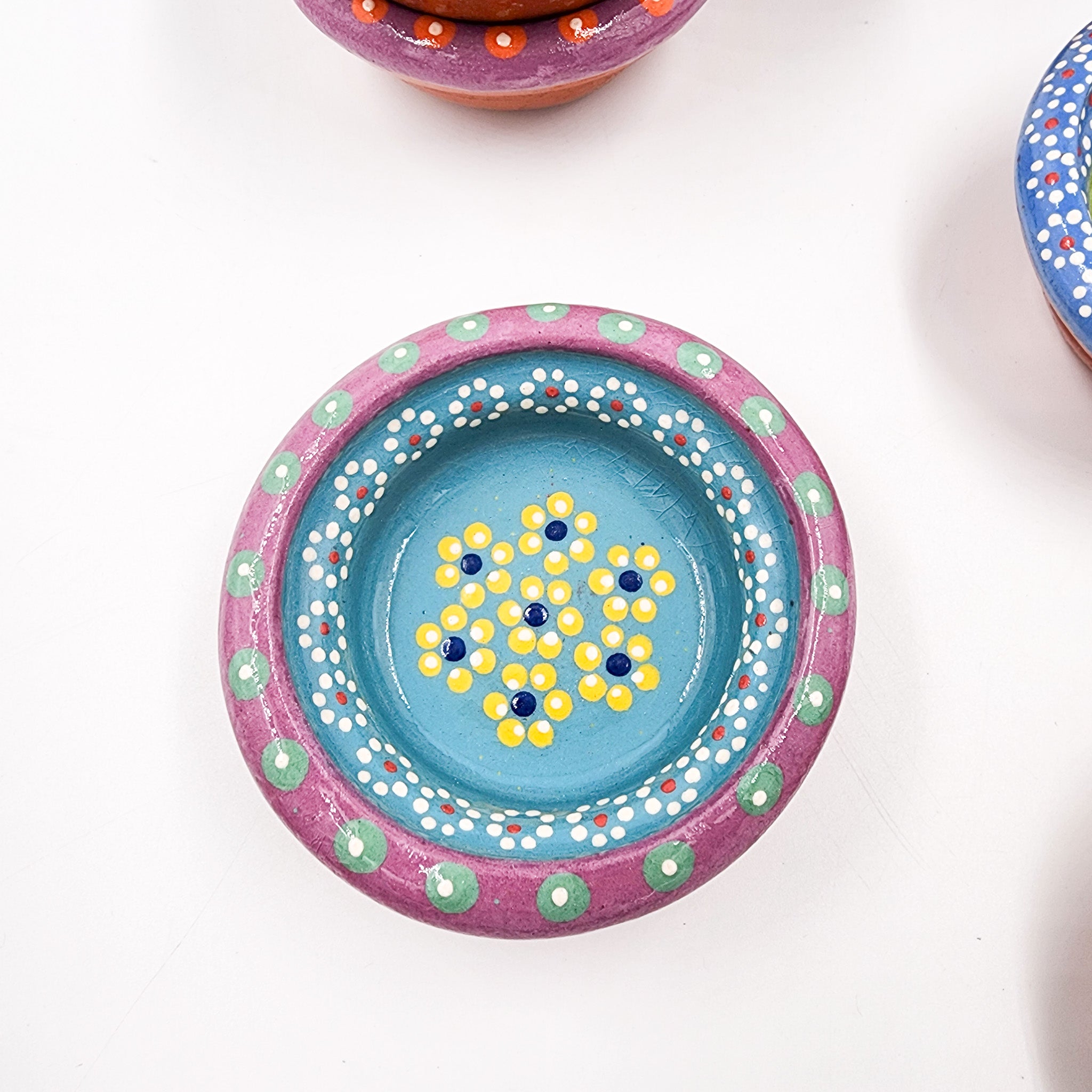 Small hand-painted clay plate