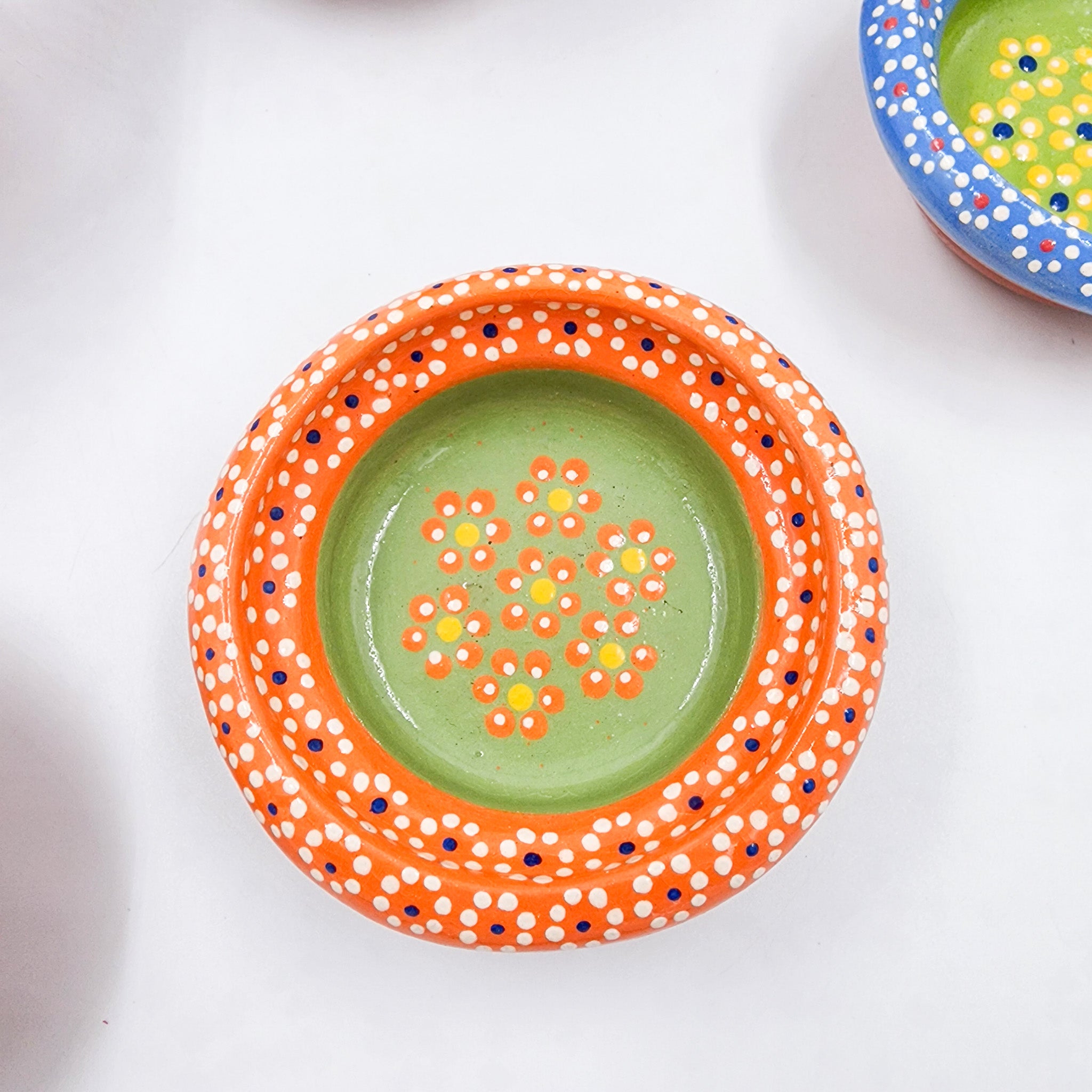 Small hand-painted clay plate