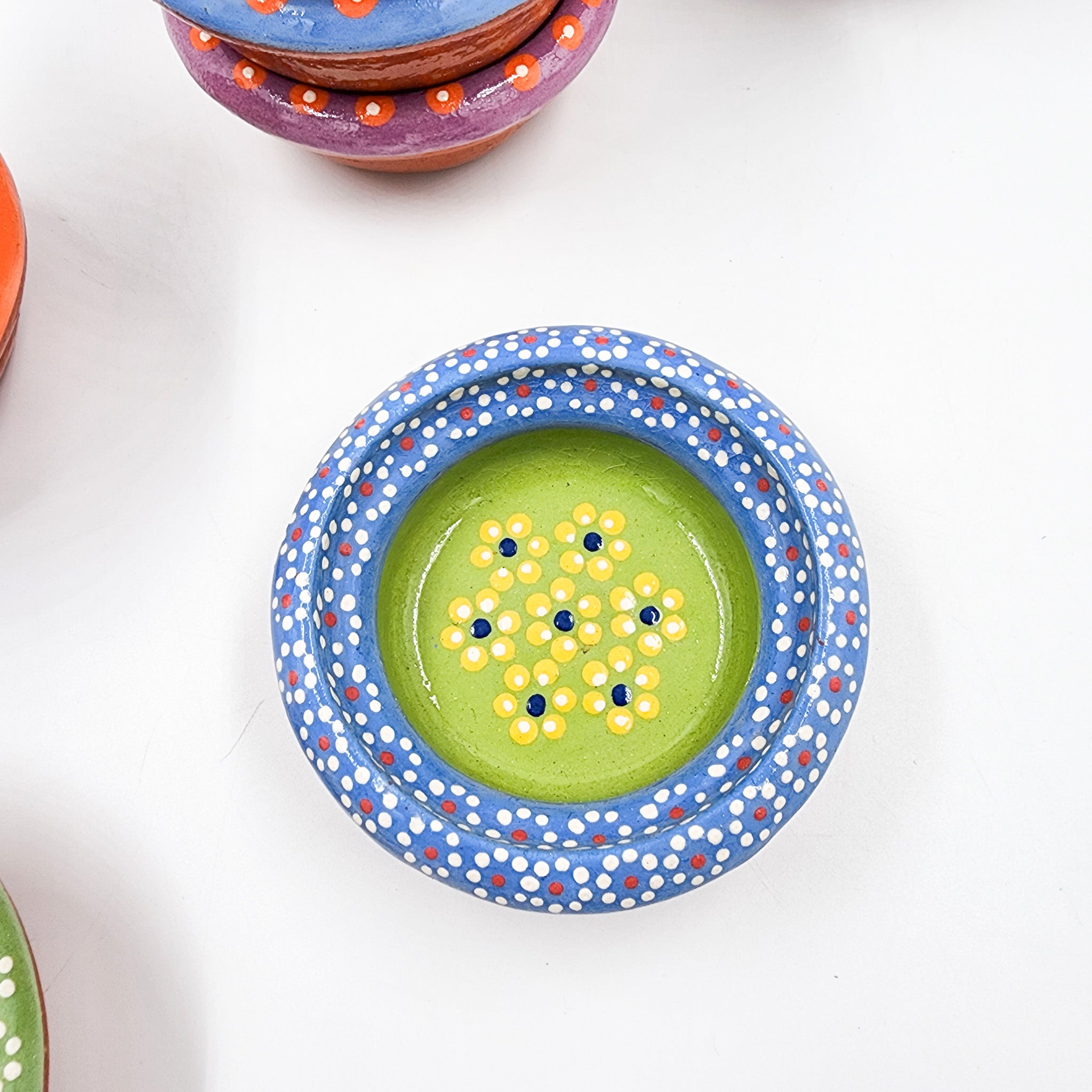 Small hand-painted clay plate