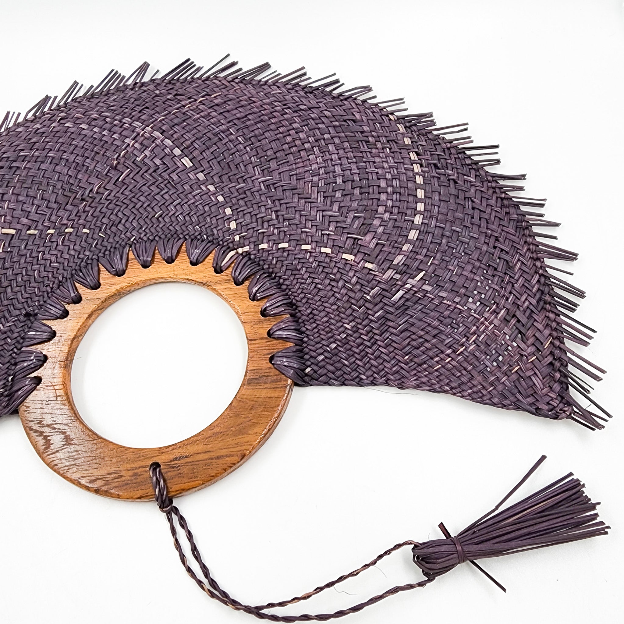 Large purple jipijapa fan with wooden handle
