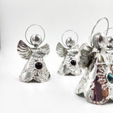 Angelitos de hojalata con canica de vidrio