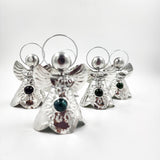 Angelitos de hojalata con canica de vidrio