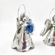Angelitos de hojalata con corazón de vidrio soplado
