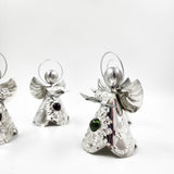 Angelitos de hojalata con canica de vidrio