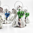 Angelitos de hojalata con corazón de vidrio soplado