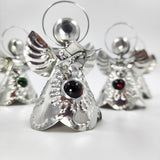 Angelitos de hojalata con canica de vidrio
