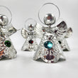 Angelitos de hojalata con canica de vidrio