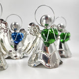 Angelitos de hojalata con corazón de vidrio soplado
