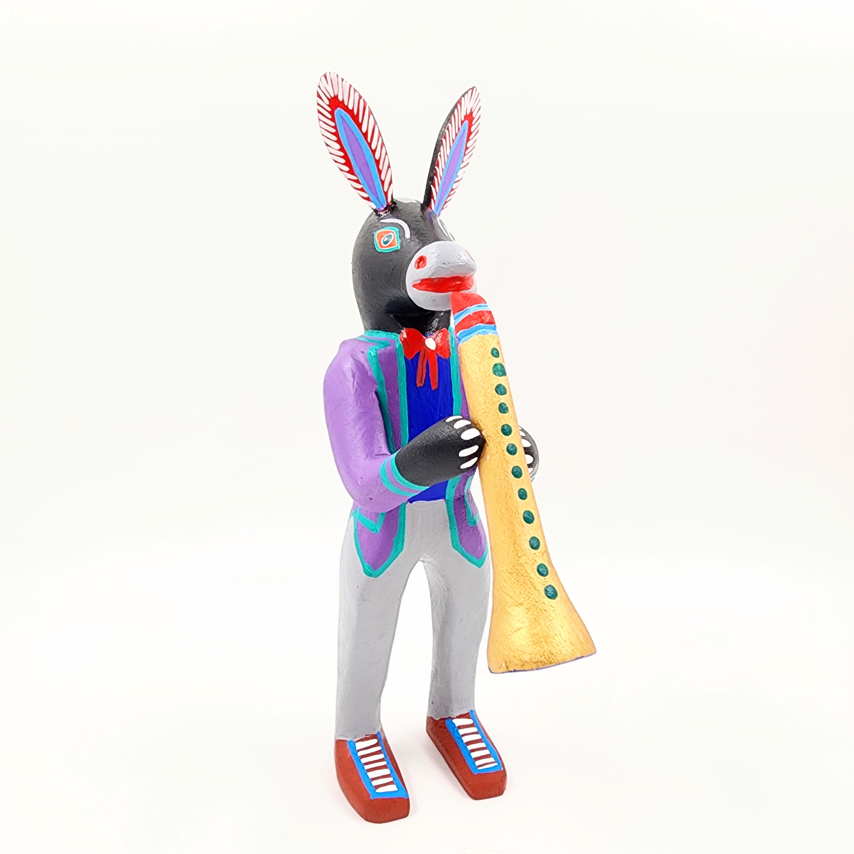 Burro con clarinete - talla de madera alebrije