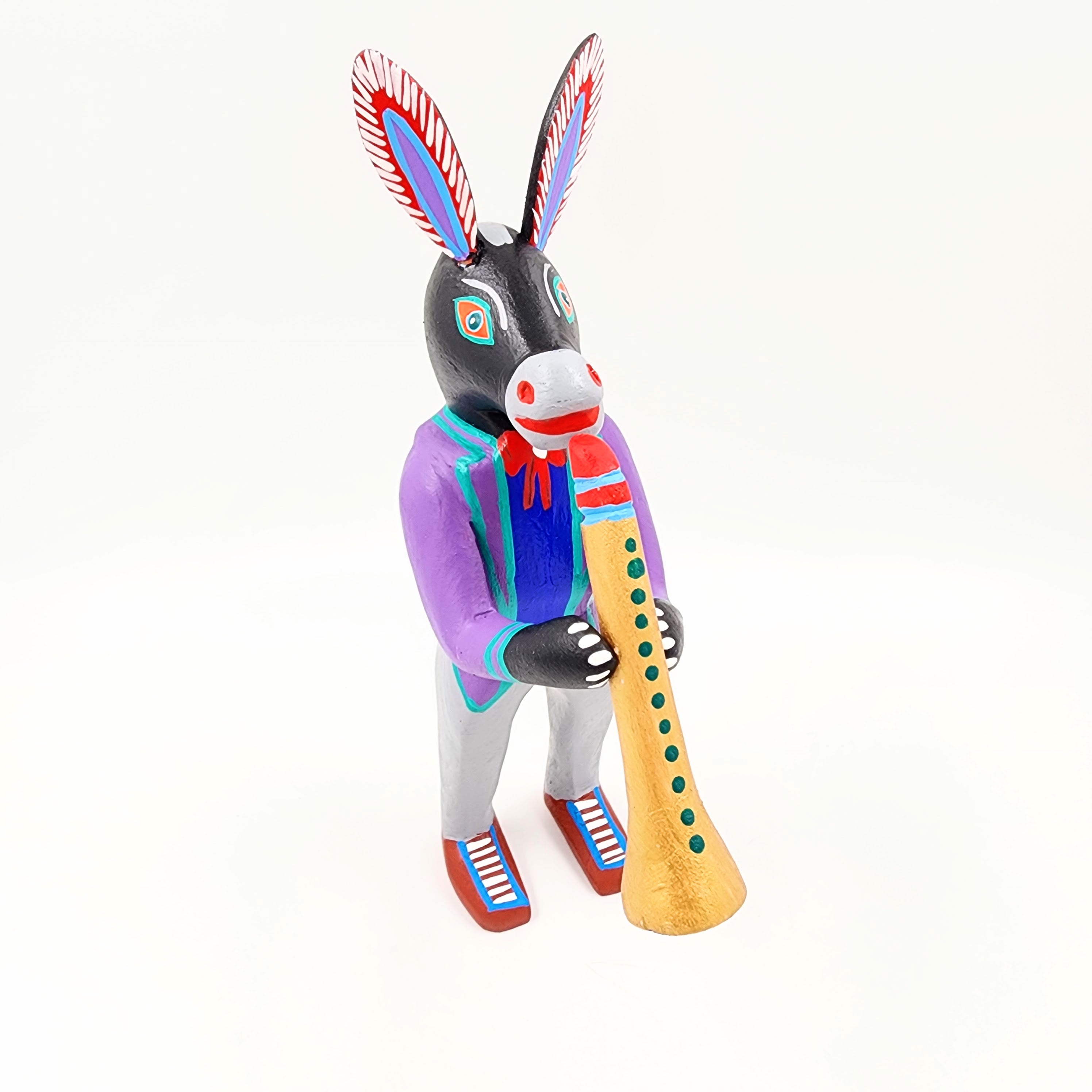 Burro con clarinete - talla de madera alebrije
