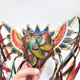 Corazón con pájaro y alas de madera