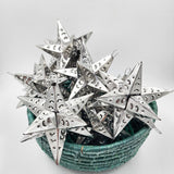 Estrella de hojalata plateada