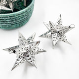 Estrella de hojalata plateada