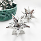 Estrella de hojalata plateada