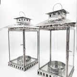 Farol artesanal de hojalata repujada con vidrio