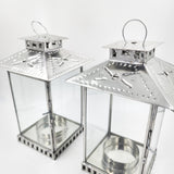 Farol artesanal de hojalata repujada con vidrio