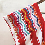 Huipil rojo y blanco con corazones y bolsas laterales – Telar de cintura artesanal de Oaxaca