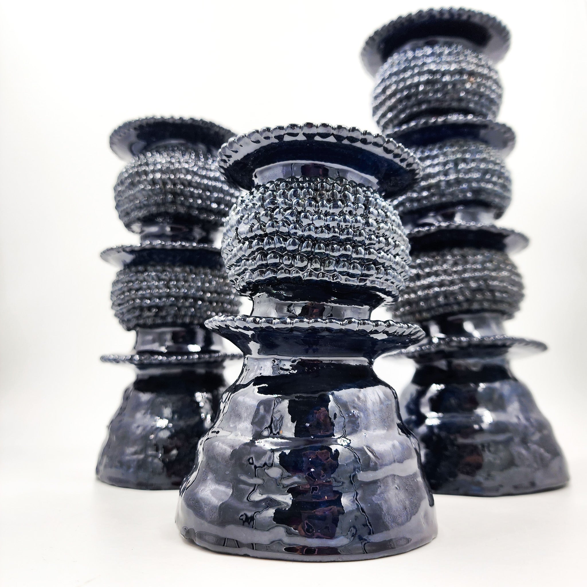 Juego de 3 candelabros de barro vidriado azul marino
