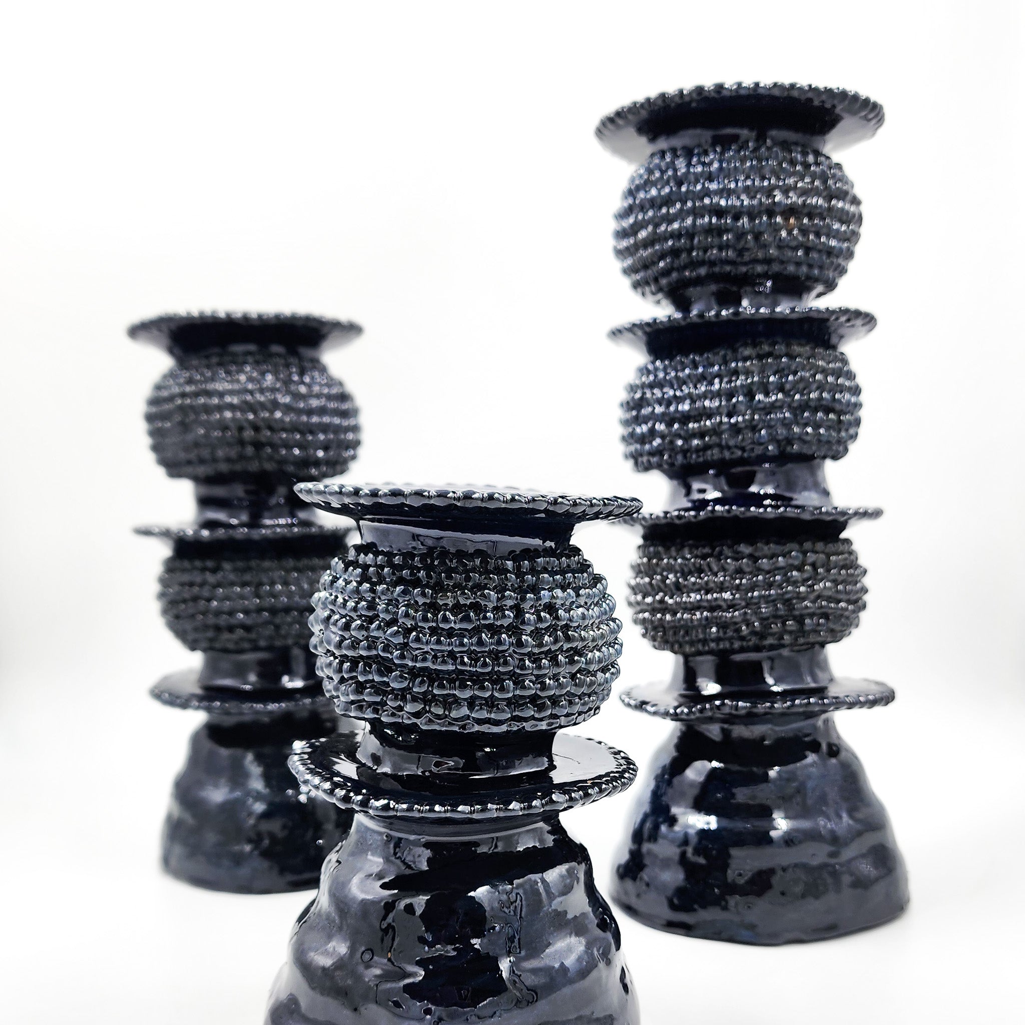 Juego de 3 candelabros de barro vidriado azul marino
