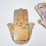 Mano milagrito con espejo