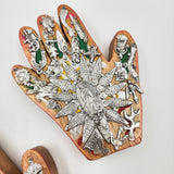 Mano de milagritos con Virgen de Guadalupe