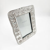 Marco para fotos de hojalata repujada