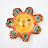 Máscara Sol hecha de coco