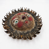 Sun mask made of coconut and seeds as rays