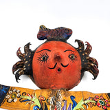 Muñeco artesanal con máscara de coco