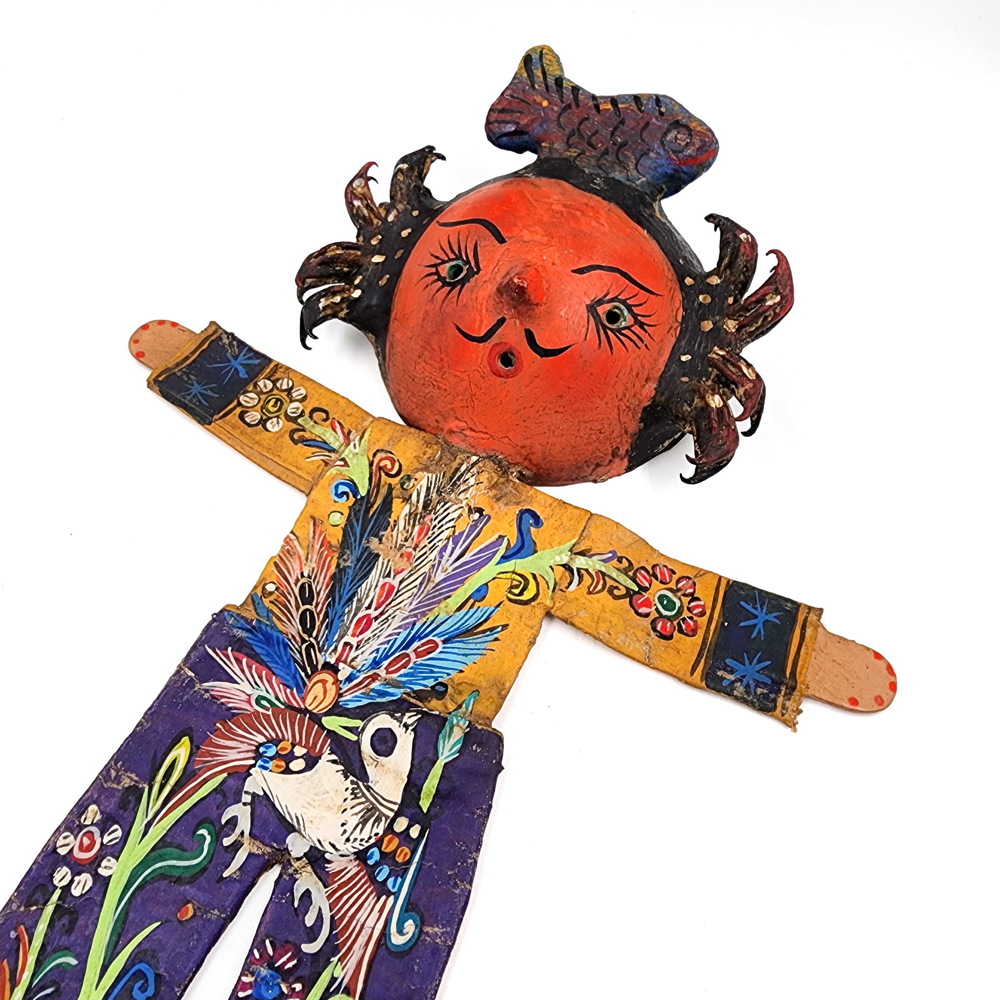 Muñeco artesanal con máscara de coco