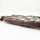 Ristra de peces con milagritos tallados en madera