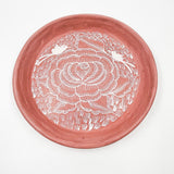 Round burnished clay plate