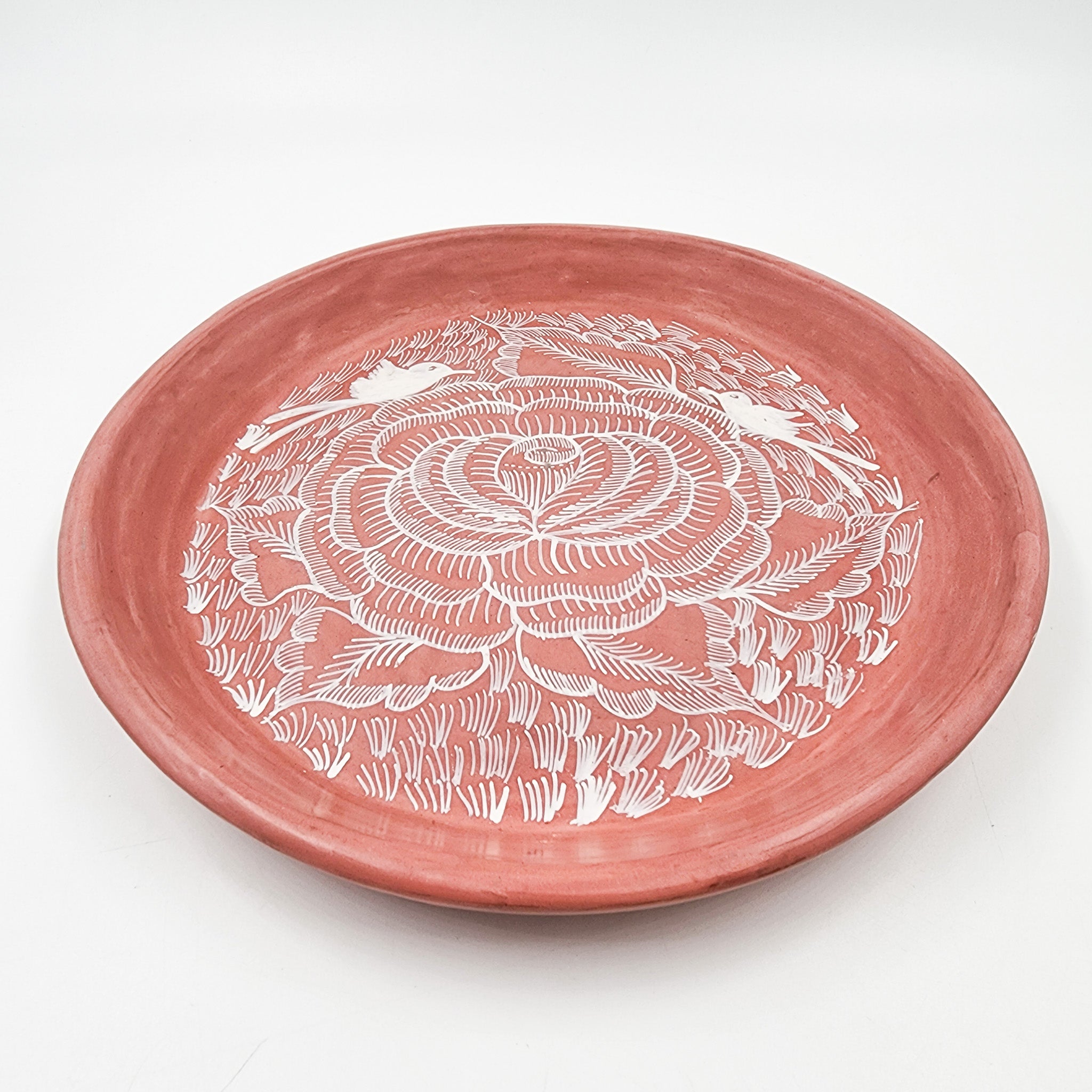 Round burnished clay plate