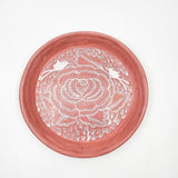 Round burnished clay plate
