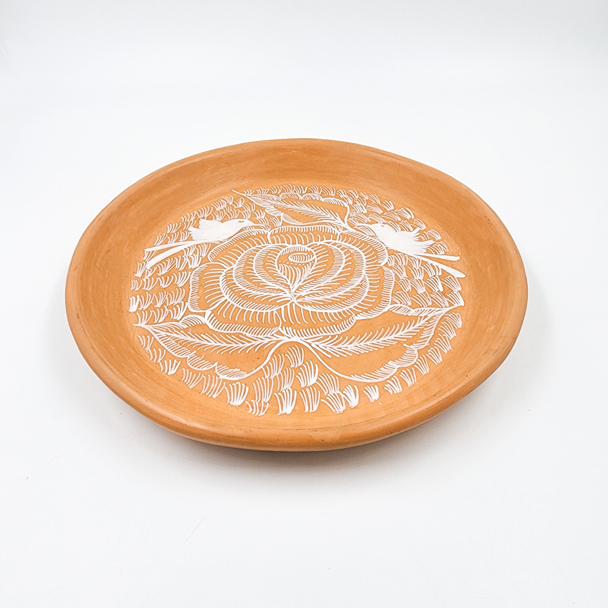 Round burnished clay plate
